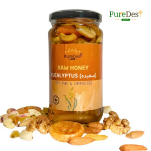 Pure Nuts Honey jar, featuring 100% raw, cold-extracted honey combined with premium nuts, with no additives or heat processing. The honey has a light golden hue, packed with natural nutrients, providing a wholesome and delicious treat.