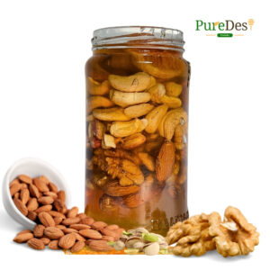 Pure Nuts Honey jar, featuring 100% raw, cold-extracted honey combined with premium nuts, with no additives or heat processing. The honey has a light golden hue, packed with natural nutrients, providing a wholesome and delicious treat